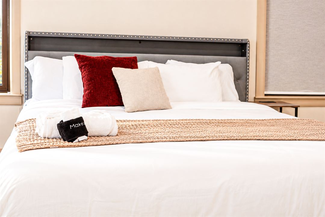 A king bed, made up, The Main Villa